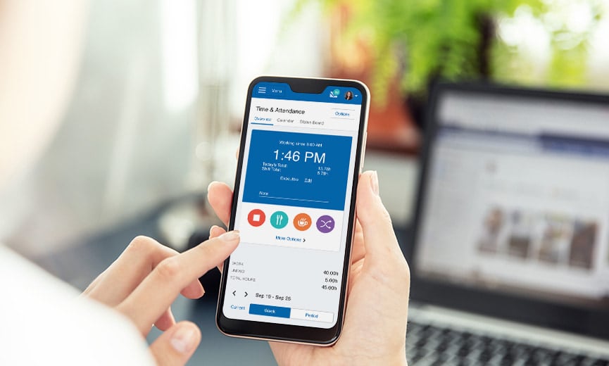 An employee uses a time and attendance software mobile app